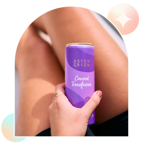 Hand holding refreshing Aspen Green Concord Transfusion THC drink