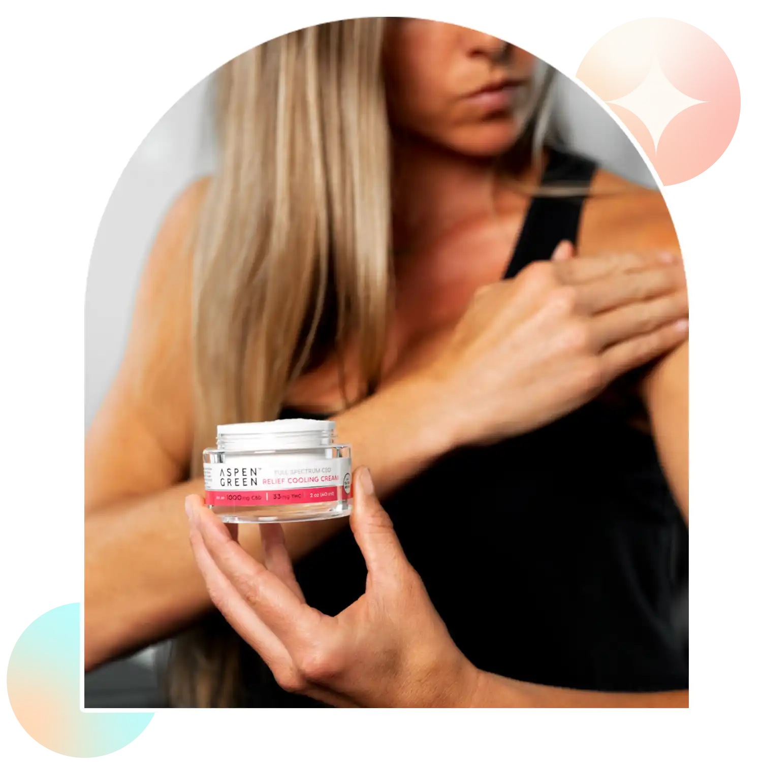 Woman rubbing in Aspen Green Relief Cooling Cream on shoulder