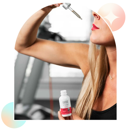 Woman taking Aspen Green Relief CBD Oil by dropper