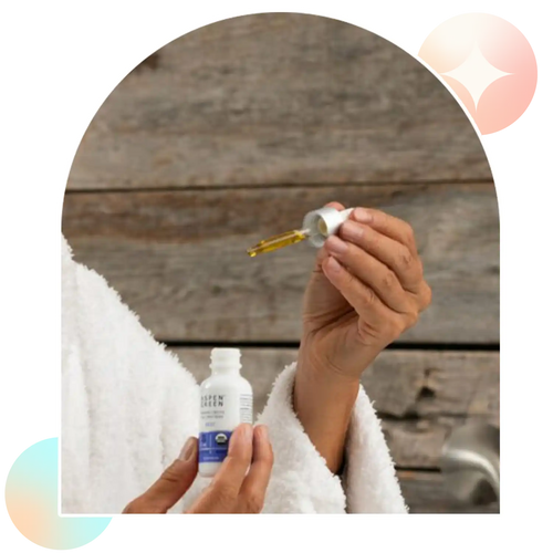 Woman about to take Aspen Green Rest CBD Oil